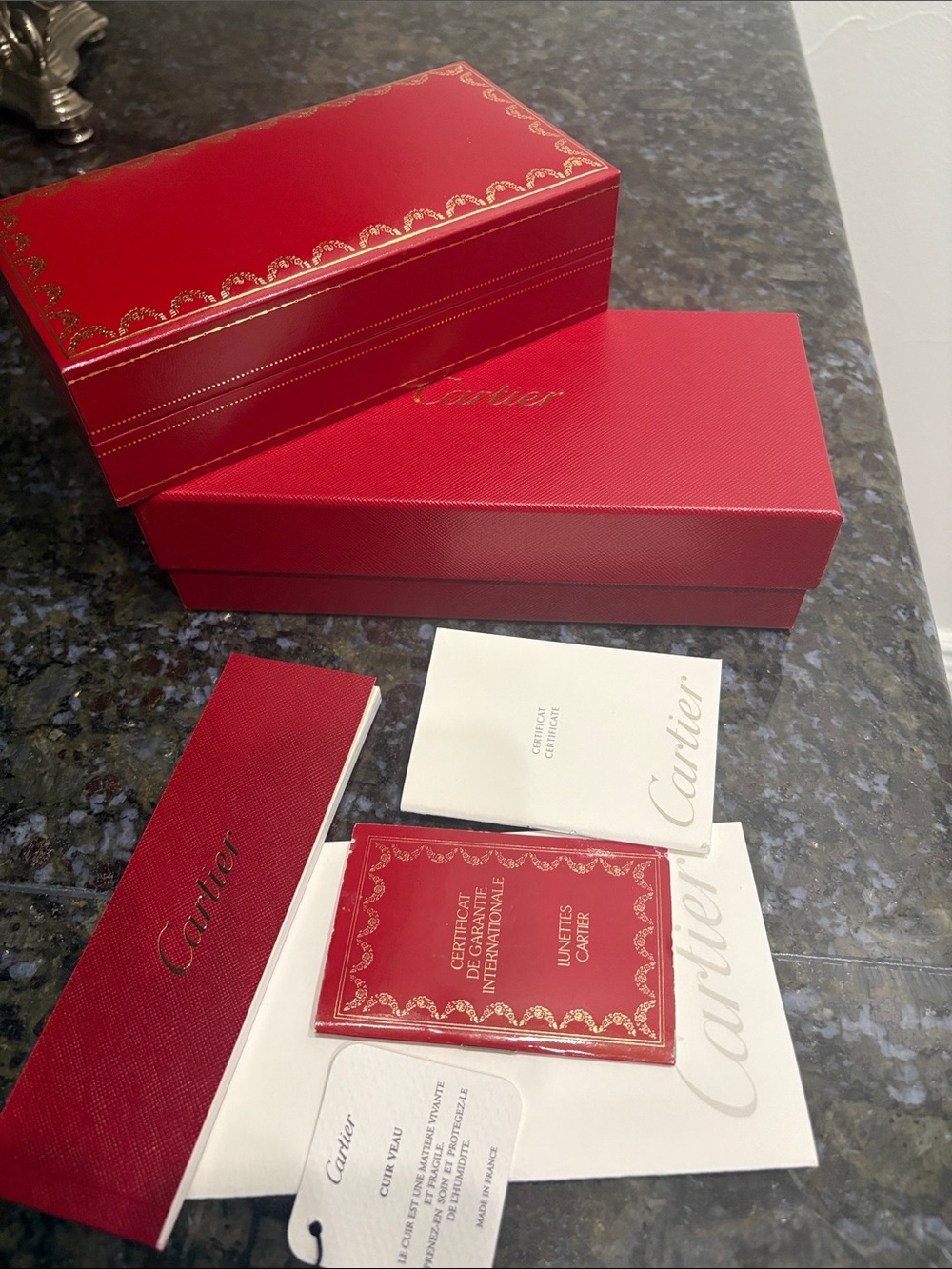 Cartier Red Jewelry Boxes with Gold Accents and Booklets